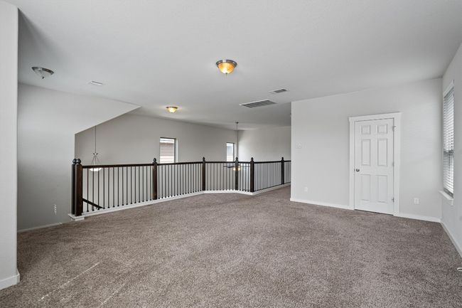Empty room featuring carpet floors and healthy amount of natural light | Image 28
