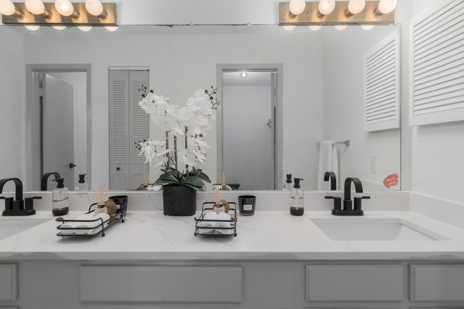 Bathroom with a sink, a closet, and double vanity | Image 33