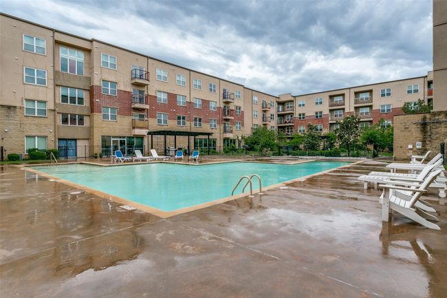 Community pool with a patio area | Image 4