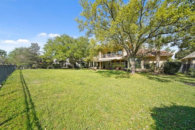 So many possibilities for this large backyard. Thinking about a swimming pool? There's plenty of space for one! | Image 46