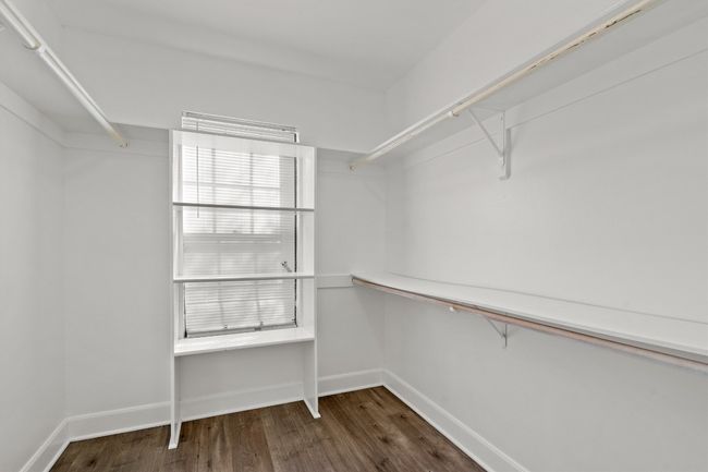 Walk in closet featuring wood finished floors | Image 26
