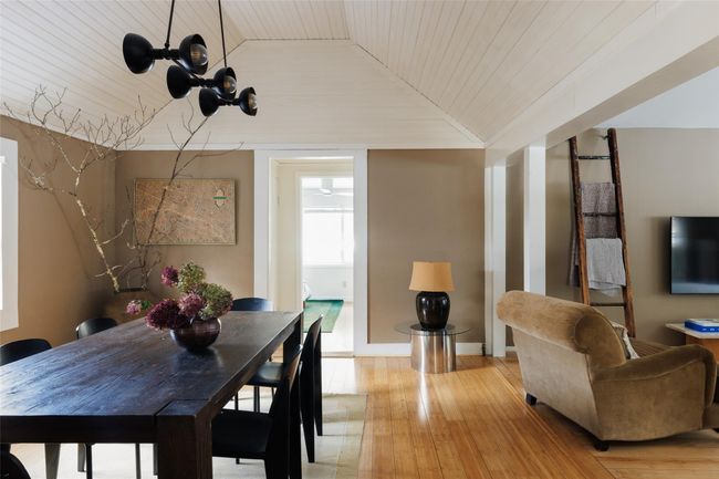 Dining area featuring wood ceiling, crown molding, vaulted ceiling, and light wood-type flooring | Image 10