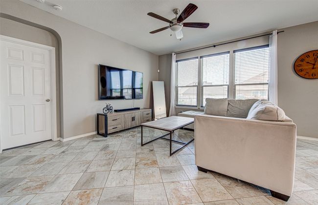 Living room with ceiling fan and baseboards | Image 5