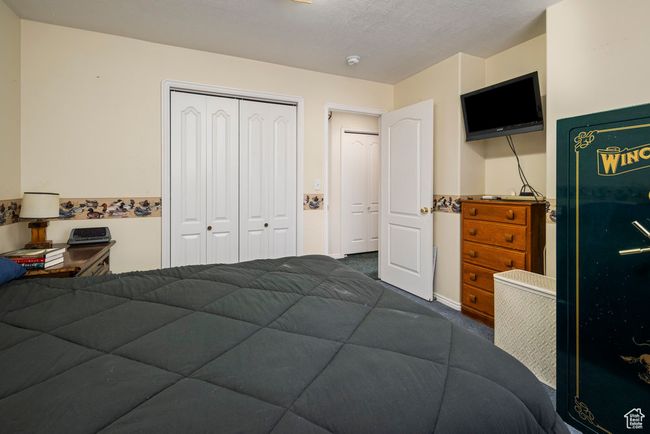 Bedroom with a closet and carpet flooring | Image 33