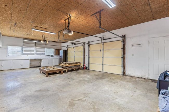 Garage with a garage door opener | Image 59