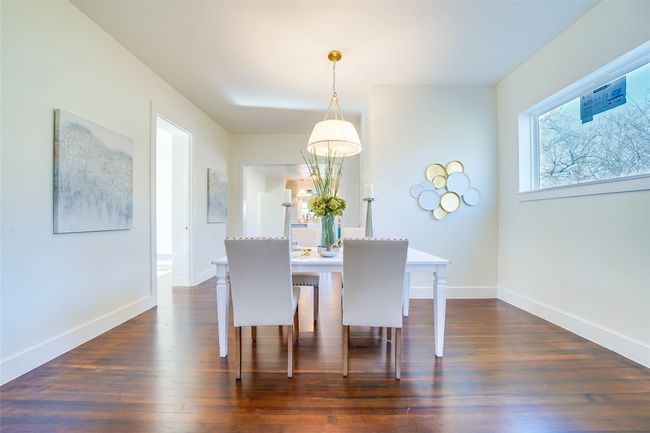Dining area with dark wood-type flooring | Image 12