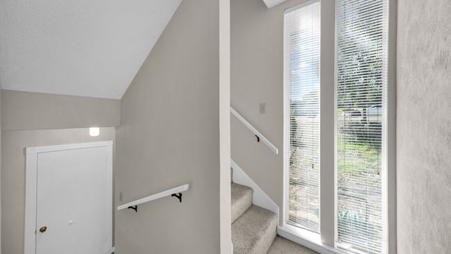 Staircase featuring vaulted ceiling | Image 26