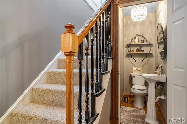 Stairs with wood finished floors and baseboards | Image 63