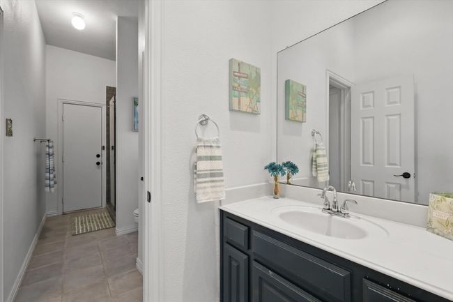 Dedicated vanity for bedroom #2. Note door to outside making this a functional pool bath, as well. | Image 27