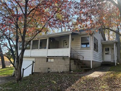 View of front facade featuring a garage | Image 1