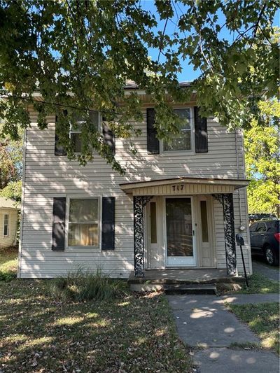 View of front of property featuring a porch | Image 1