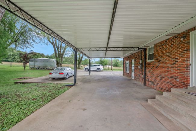 VERSATILE COVERED AREA CAN ALL BE FOR ENTERTAINING WHEN NOT NEEDED AS CARPORT. | Image 8