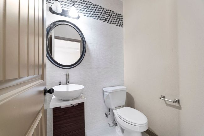 Half bath with vanity and tile walls | Image 30