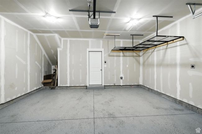 Garage with a garage door opener | Image 23