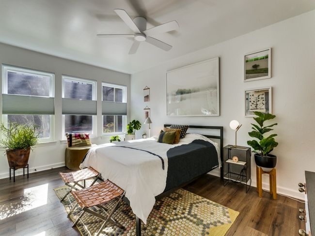 Bedroom featuring dark wood-type flooring, baseboards, and a ceiling fan | Image 6