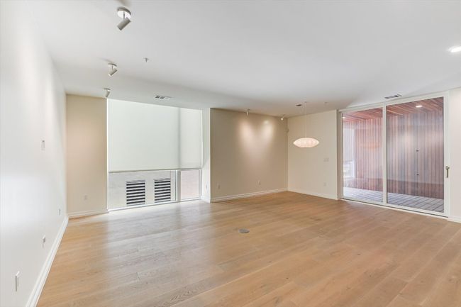 Featuring light wood finished floors, baseboards, and visible vents | Image 4