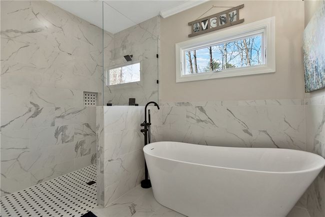 Primary bathroom soaking tub abd walk-in shower. | Image 27