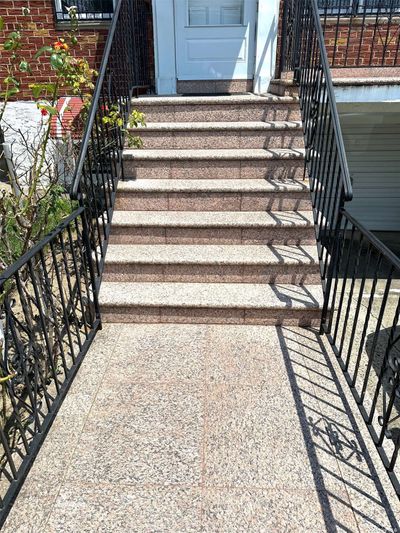 Beautifully Tiled Front Walkway With Railings | Image 2