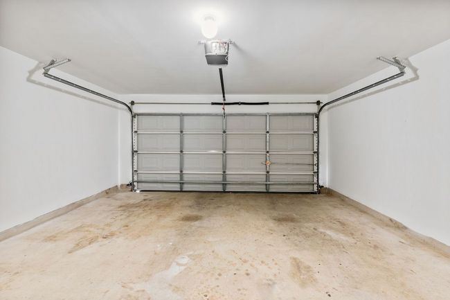 Garage featuring a garage door opener | Image 37