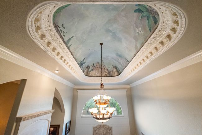 Detailed view of a chandelier, a tray ceiling, and crown molding | Image 16