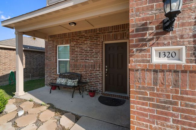 Property entrance featuring brick siding | Image 8