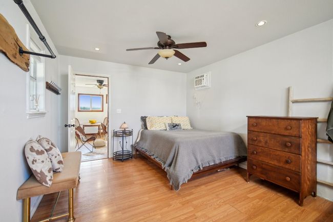 Bedroom with door to the main area. This is one big, undivided room with the bathroom area at your back. | Image 9