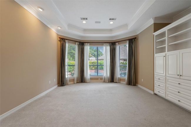 Another view of the primary bedroom with the great built ins | Image 20
