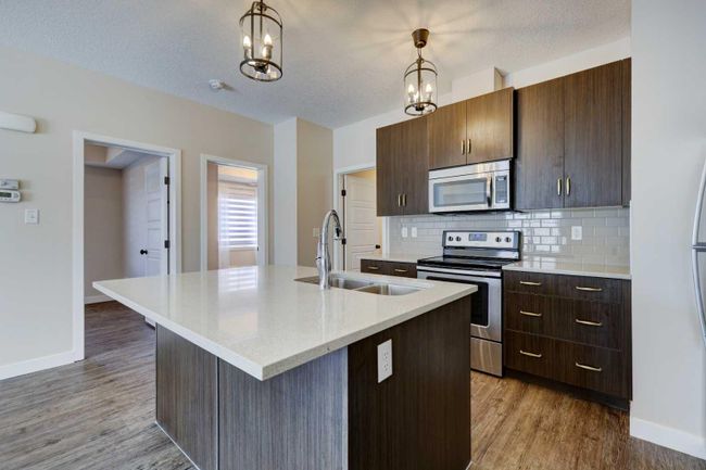 1411 - 2461 Baysprings Link Sw, Home with 2 bedrooms, 1 bathrooms and 1 parking in Airdrie AB | Image 7