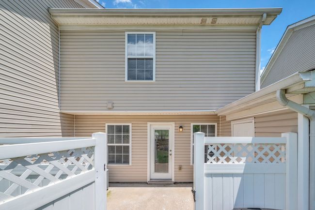 This is the view looking back at your back door and fenced in patio from the yard | Image 28
