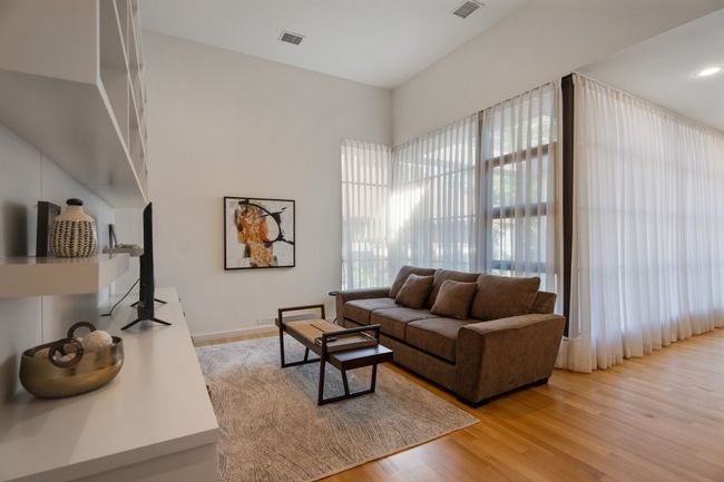 Living area with light wood-style flooring | Image 21