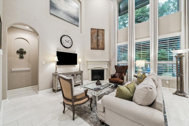 Stunning two story family room bathed in natural light. | Image 6