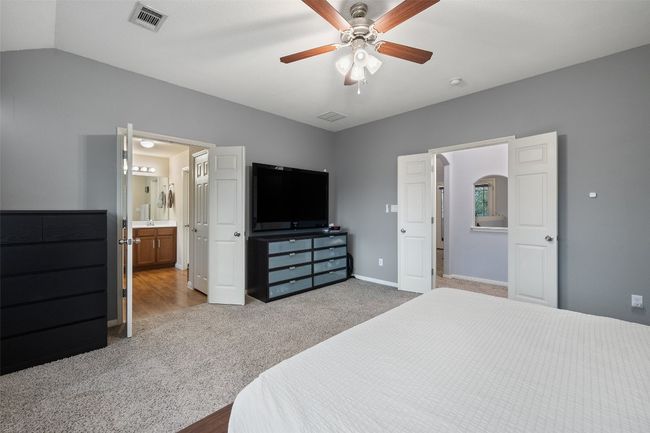 Tranquil primary suite with soundproof windows, automatic blinds, walk in closet, dual vanities, garden tub, walk in shower and private commode. | Image 20