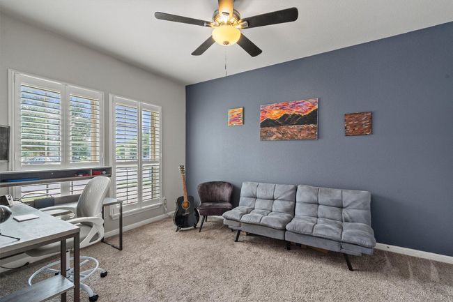 Office area featuring carpet floors, ceiling fan, and baseboards | Image 8