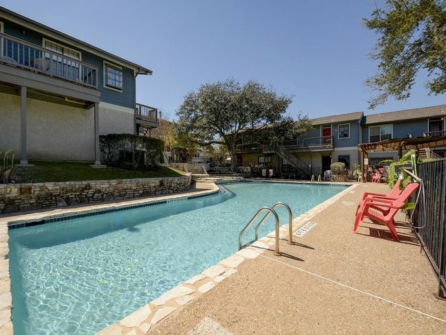 Community pool with stairs and a patio | Image 18
