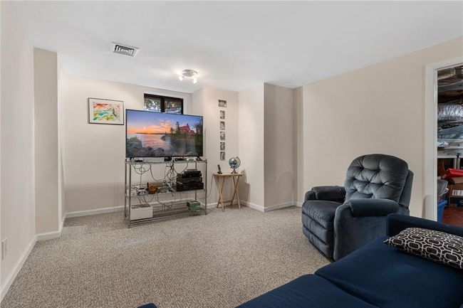 Fully finished basement next to utilities and storage area | Image 29