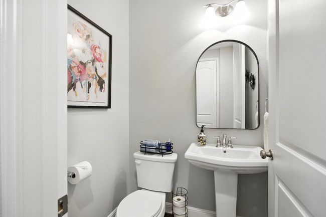 Bathroom with toilet and baseboards | Image 15