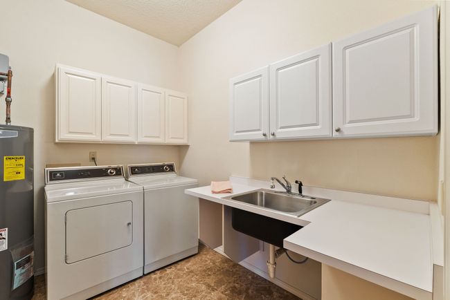 Lower level laundry room w/ floor drain & sink | Image 32
