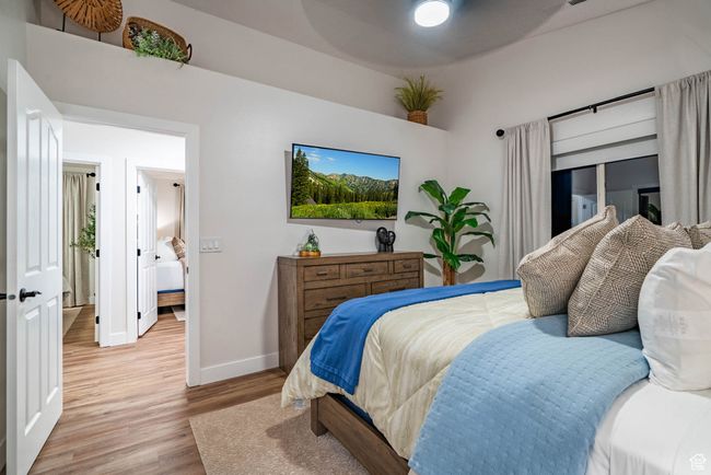Bedroom with light hardwood / wood-style flooring | Image 7