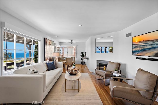 Living Room with fireplace and abundant light. | Image 5