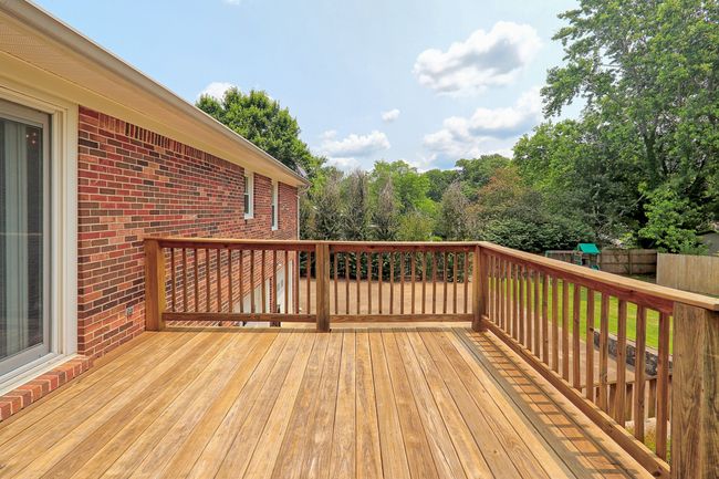 Deck outside kitchen area. | Image 28