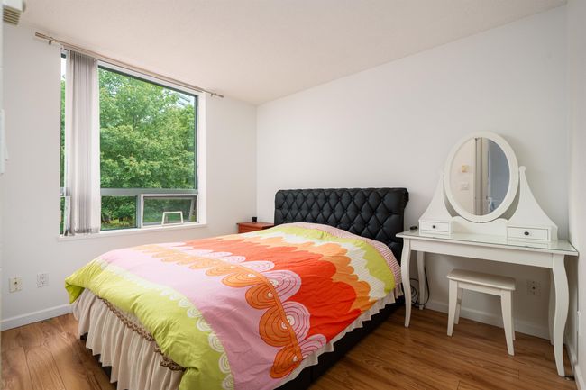 Bedroom featuring wood finished floors and baseboards | Image 15
