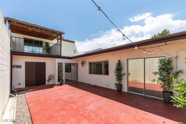 Back of property with stucco siding and a patio area | Image 45