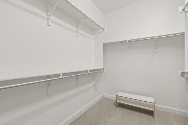 Spacious closet with carpet floors | Image 22