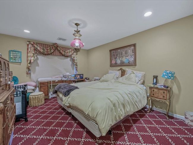 Bedroom with dark colored carpet, recessed lighting, and baseboards | Image 20