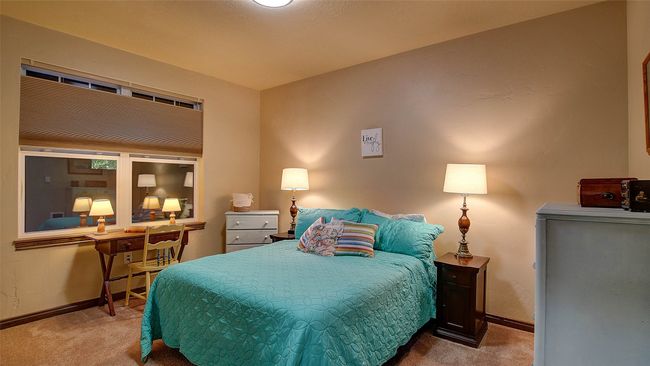 Guest Bedroom with direct access to the second bathroom, carpeted, neutral tones. Top down bottom up shades for privacy. Spacious closet. | Image 9