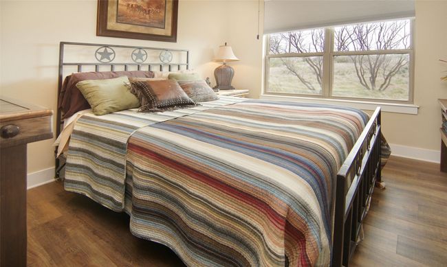 Bedroom with baseboards and dark wood-type flooring | Image 18