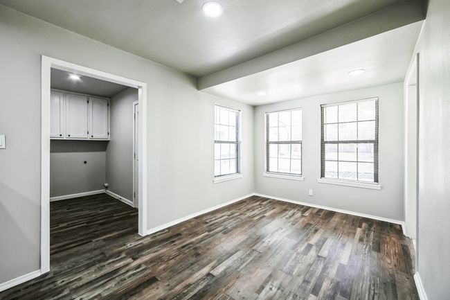 Unfurnished dining area featuring recessed lighting, baseboards, and dark wood-style floors | Image 28