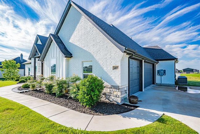 View of home's exterior with a garage | Image 36