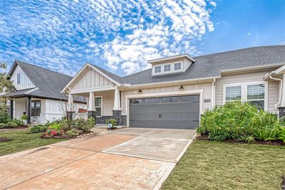 Front entrance with neighboring windows and landscaping | Image 3