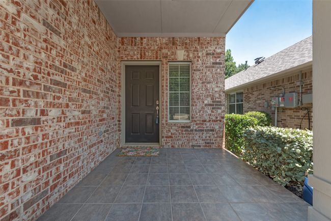 Pretty covered front patio and back patios! | Image 5